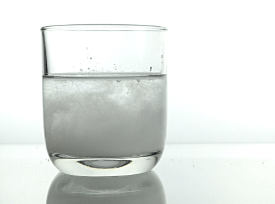 mixing the solution with water