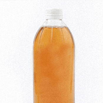 A single bottle of Vinegar in white background