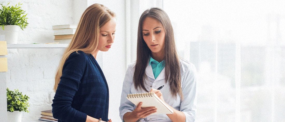 A female patient having a conversation with a doctor