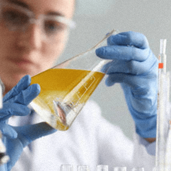A scientist holding a fake urine sample