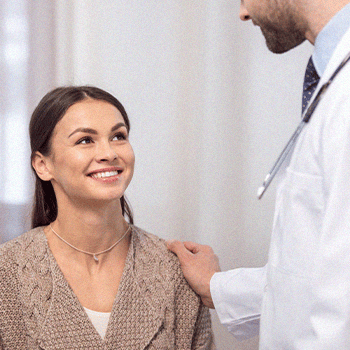 A doctor comforting a patient