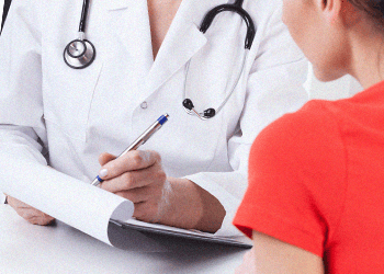 A female patient consulting in a doctor's office
