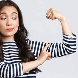 Young woman flexing her arms