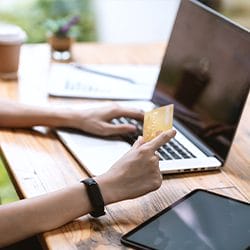 man using pc and credit carrd