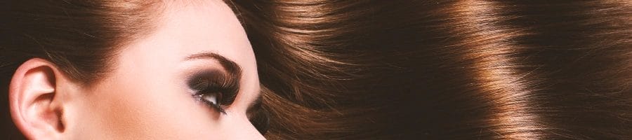 A woman laying down with luscious hair