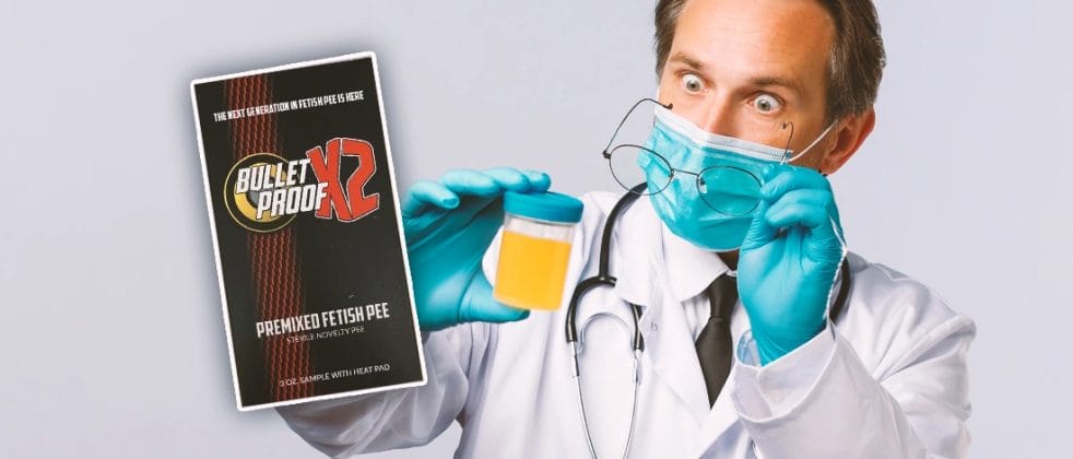 A doctor looking at a urine sample with Bulletproof X2 on the side
