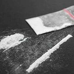 A close up image of cocaine on a table 