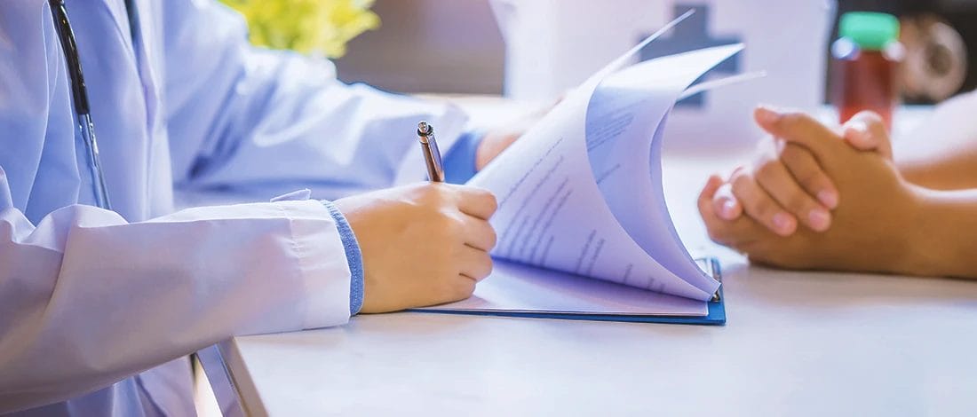 How to Pass a Nail Drug Test? (The Most Effective Methods) a doctor checking a person's fingernails for a drug test