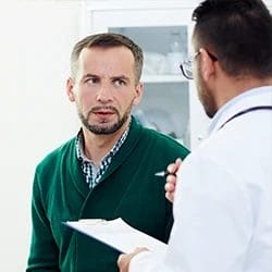 A patient having a conversation with his doctor