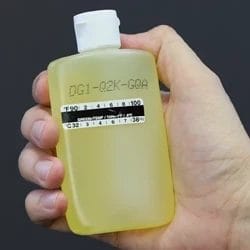 A person holding a bottle of Quick Fix urine