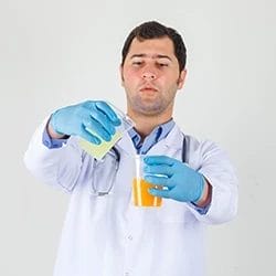 A doctor mixing two chemicals
