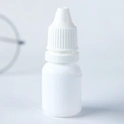 A white container of Visine eye drops
